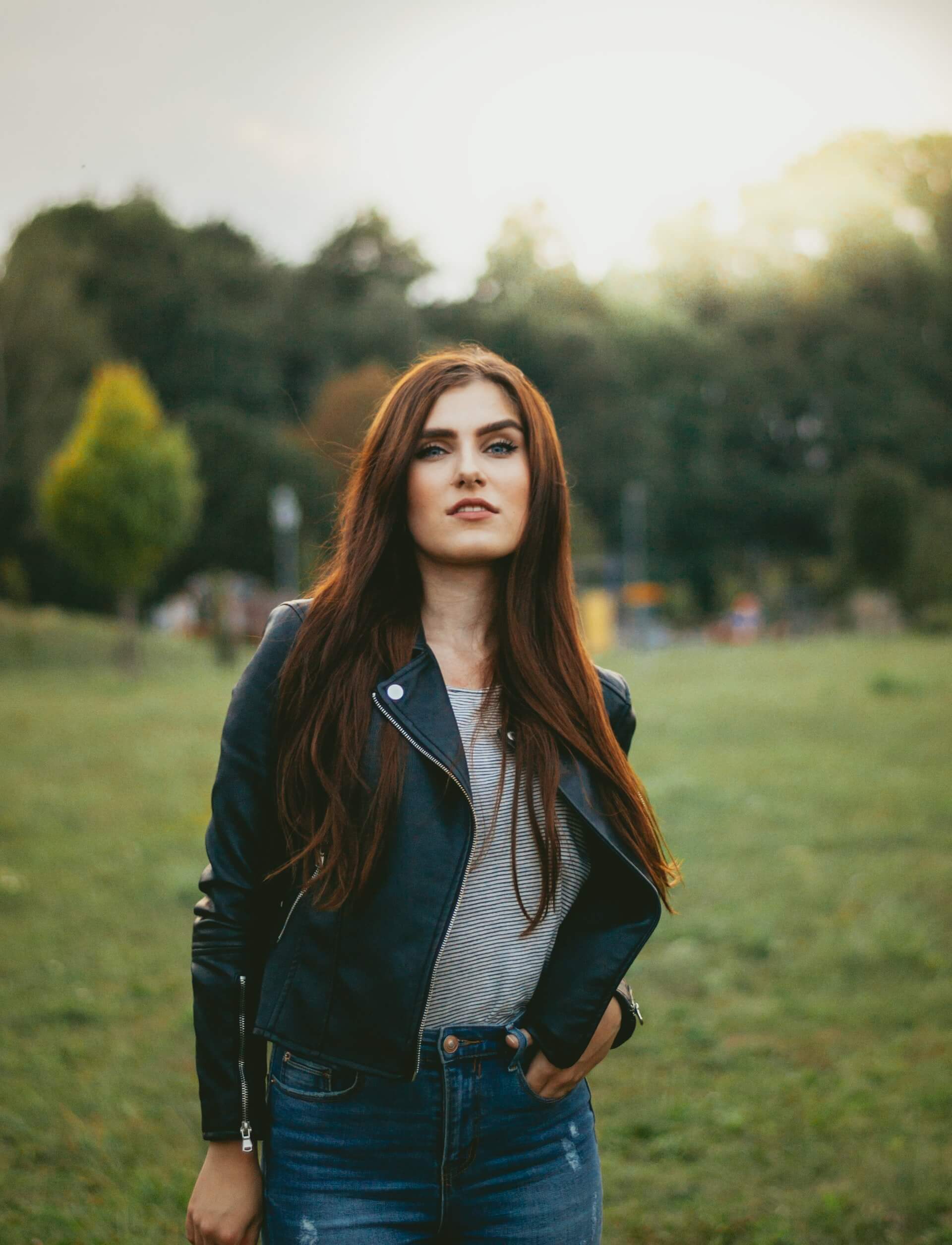 Full length portrait of stylish young girl wear on leather jacket and  ripped jeans. Street fashion model style. Stock Photo | Adobe Stock